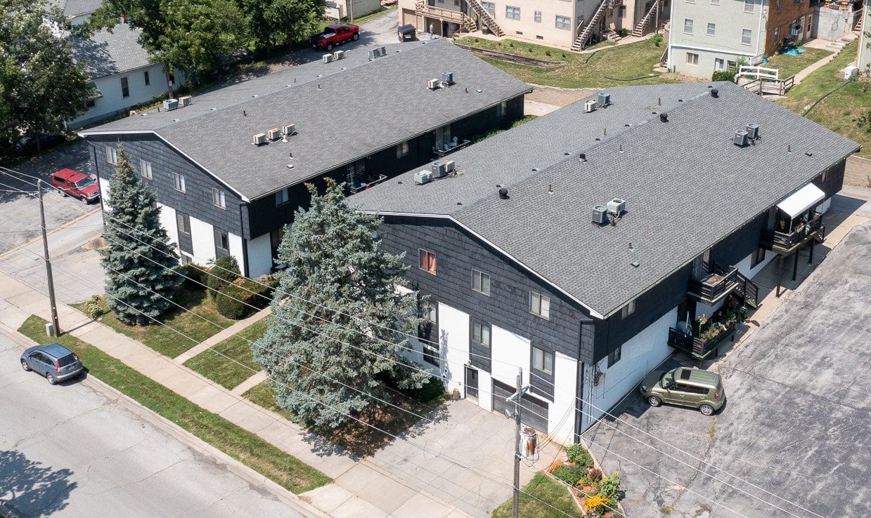 An aerial view of two matching multi-family homes.
